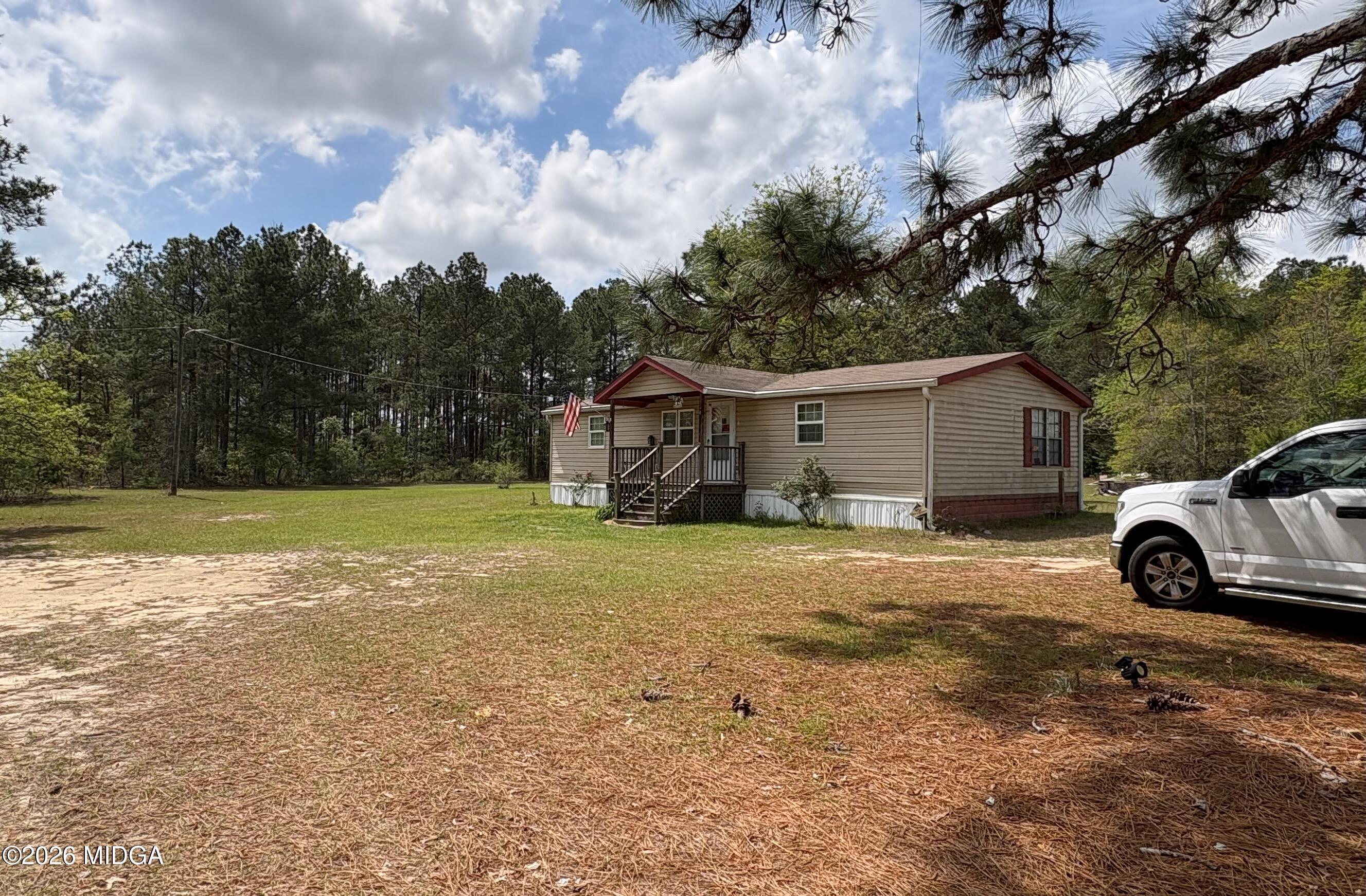 346 Quail Run Road Roberta, GA 31078 - Photo 1 of 15 a view of a house with backyard
