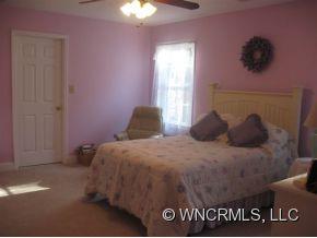 446 Grandview Drive Rutherfordton, NC 28139 - Photo 11 of 12 a bedroom with a bed and a table in it