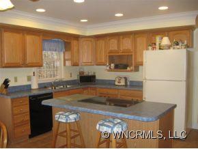 446 Grandview Drive Rutherfordton, NC 28139 - Photo 5 of 12 a kitchen with a sink a stove and a refrigerator