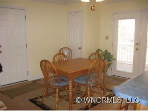 446 Grandview Drive Rutherfordton, NC 28139 - Photo 6 of 12 a view of a dining room with furniture and wooden floor
