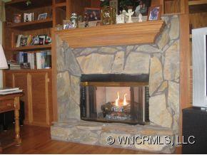 446 Grandview Drive Rutherfordton, NC 28139 - Photo 7 of 12 a view of a fireplace with a book and wooden floor