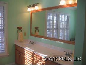 446 Grandview Drive Rutherfordton, NC 28139 - Photo 10 of 12 a bathroom with a sink and a mirror