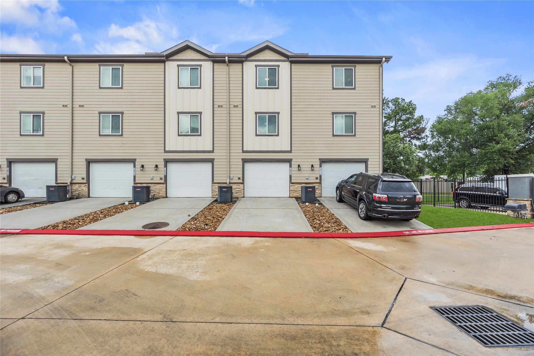 12603 Telge Road, Unit 1EH Cypress, TX 77429 - Photo 13 of 19 Each unit has an attached one-car garage and driveway.