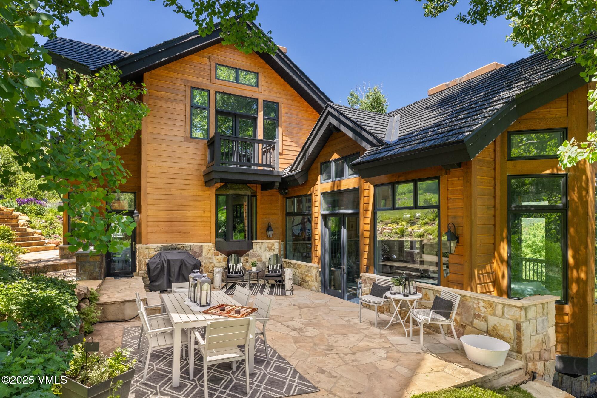 25 West Timber Drive Edwards, CO 81632 - Photo 11 of 55 a view of a patio with table and chairs and potted plants
