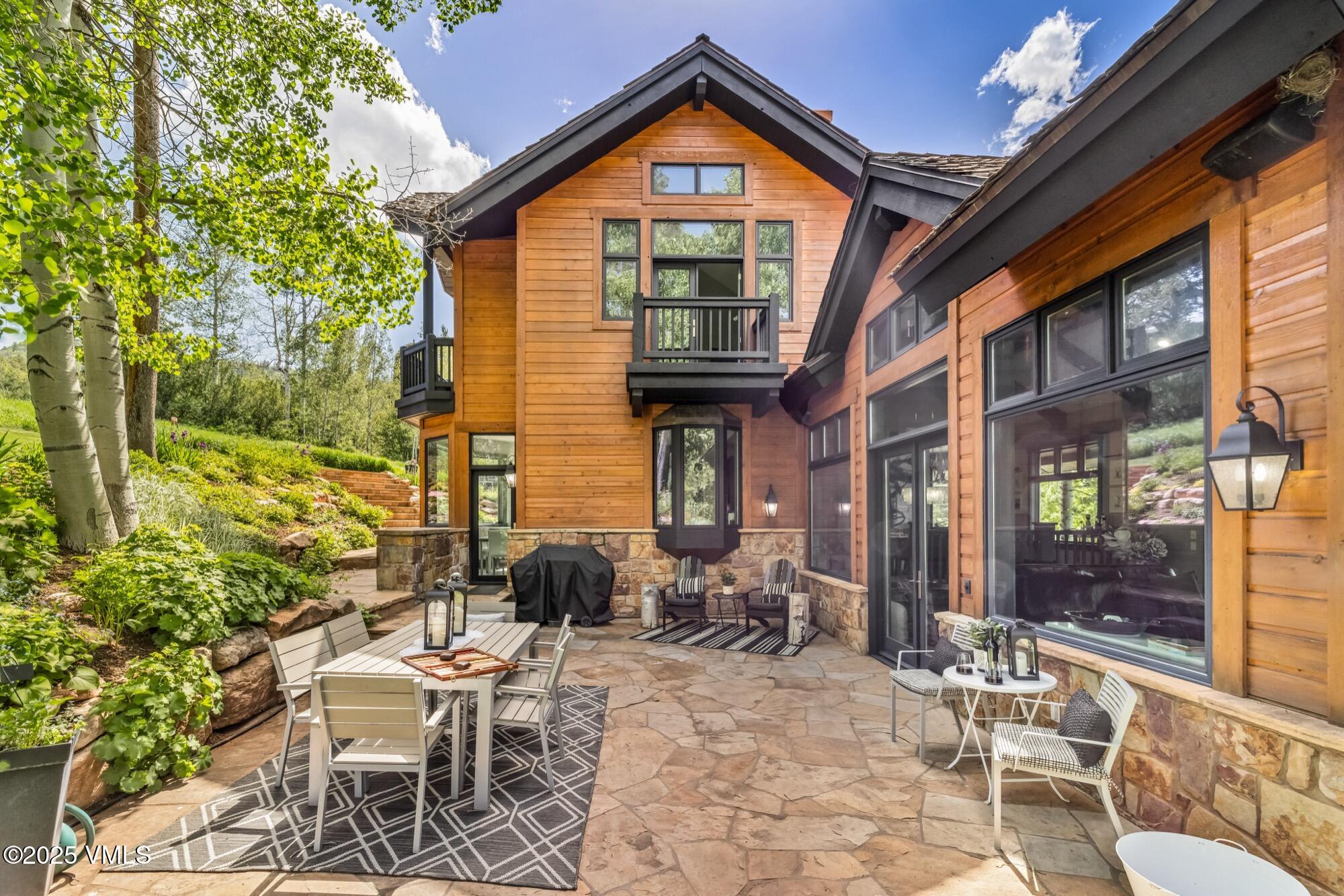 25 West Timber Drive Edwards, CO 81632 - Photo 12 of 55 a view of a chair and table in backyard of the house