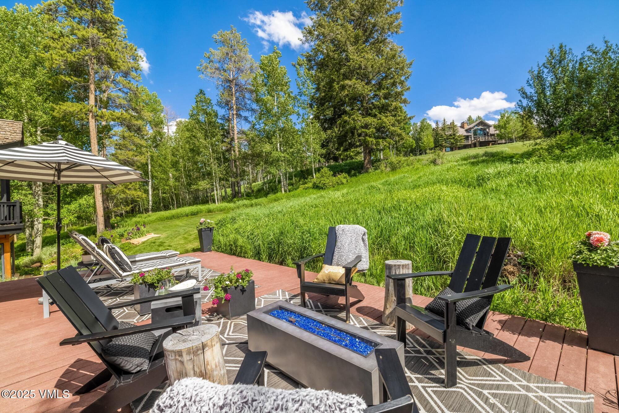 25 West Timber Drive Edwards, CO 81632 - Photo 14 of 55 a view of a chairs and table in patio with a yard
