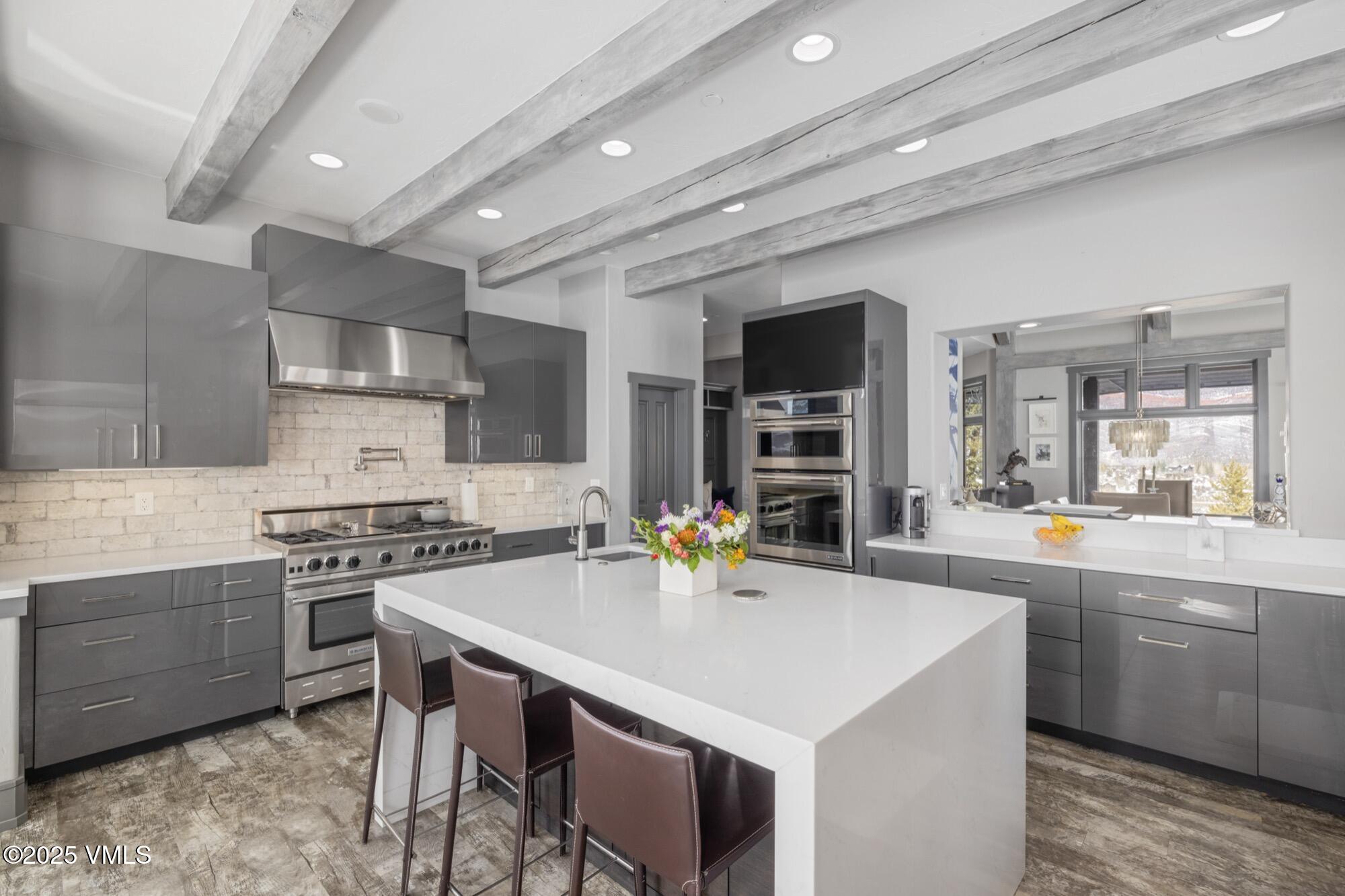 25 West Timber Drive Edwards, CO 81632 - Photo 19 of 55 a kitchen with a stove a sink and chairs