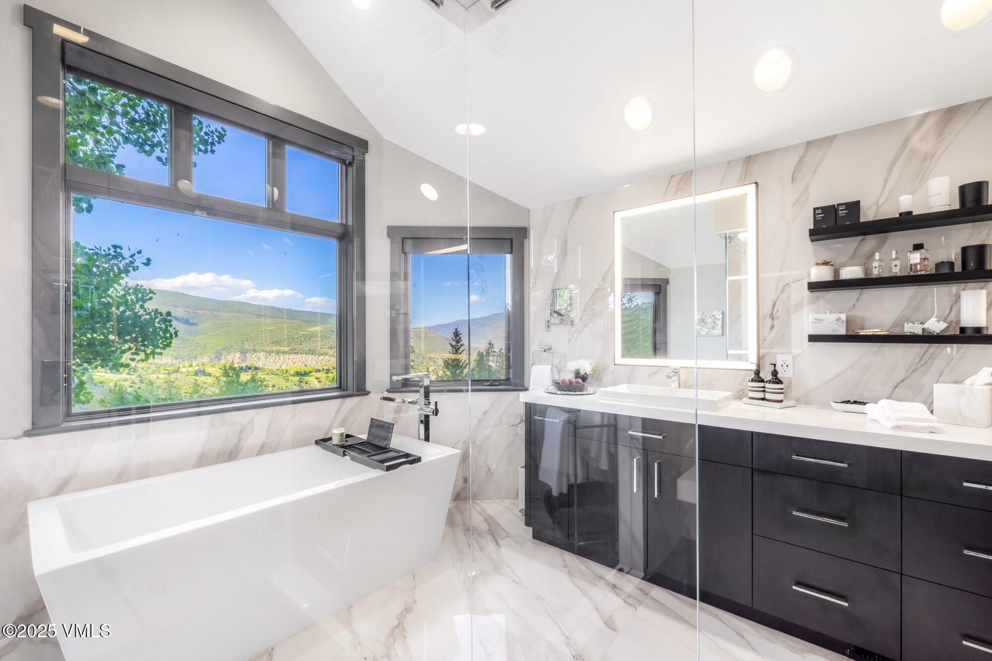 25 West Timber Drive Edwards, CO 81632 - Photo 29 of 55 a large bathroom with a large tub and sink