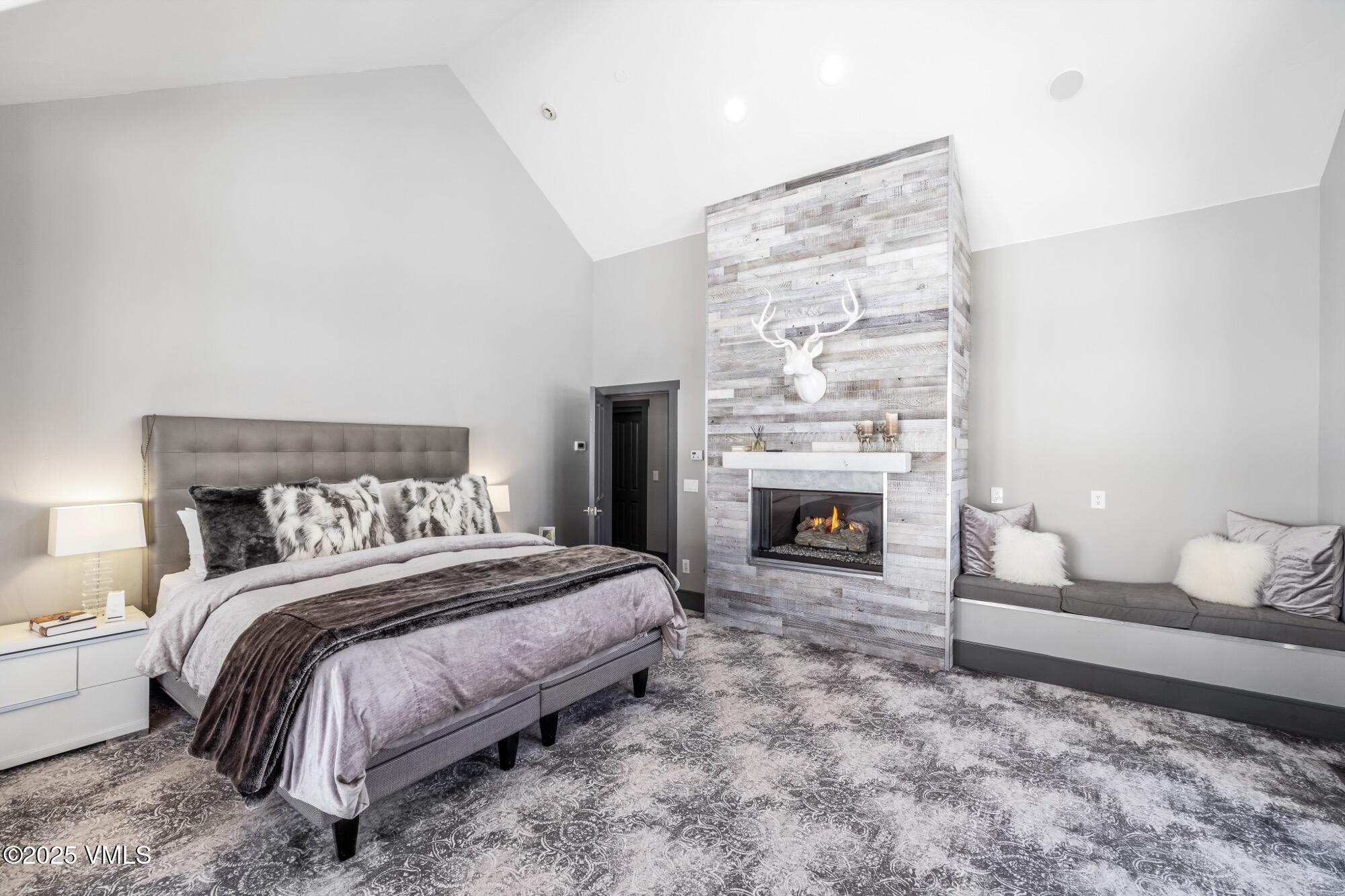 25 West Timber Drive Edwards, CO 81632 - Photo 32 of 55 a bedroom with a bed and a fireplace