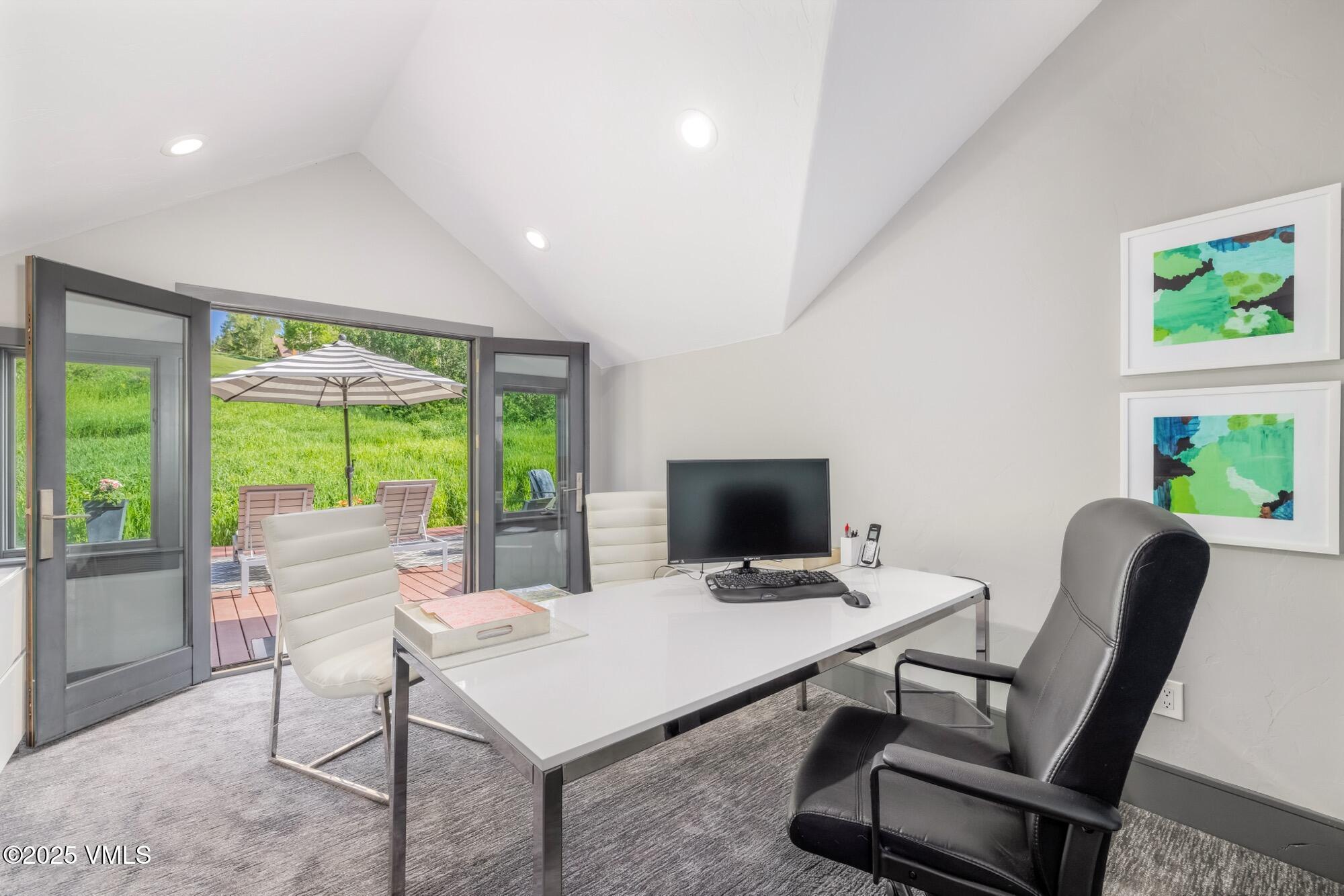25 West Timber Drive Edwards, CO 81632 - Photo 34 of 55 a work room with furniture and a floor to ceiling window