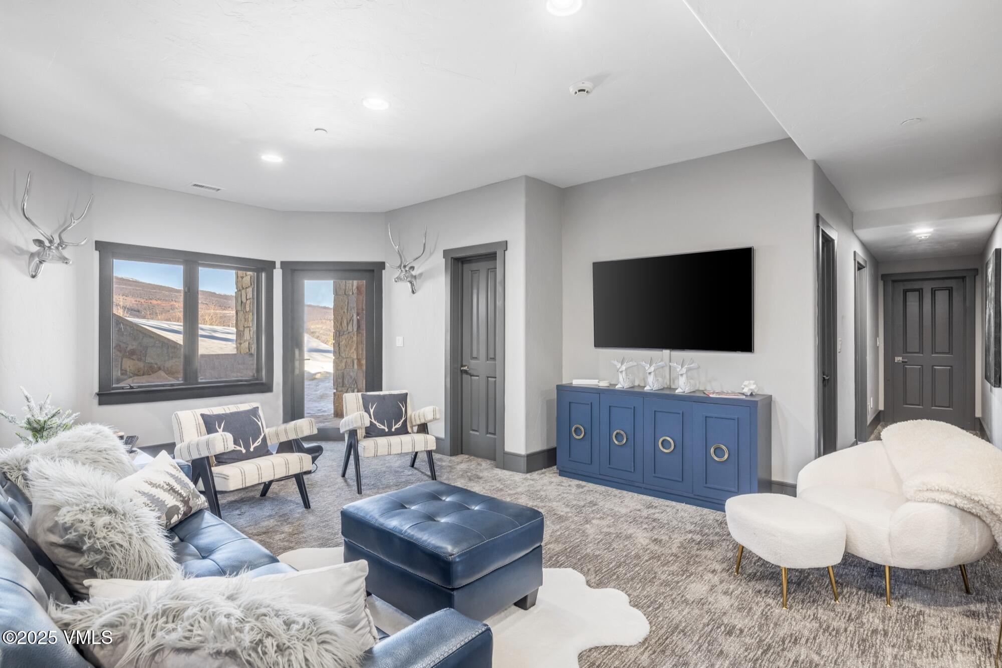 25 West Timber Drive Edwards, CO 81632 - Photo 36 of 55 a living room with furniture and a flat screen tv