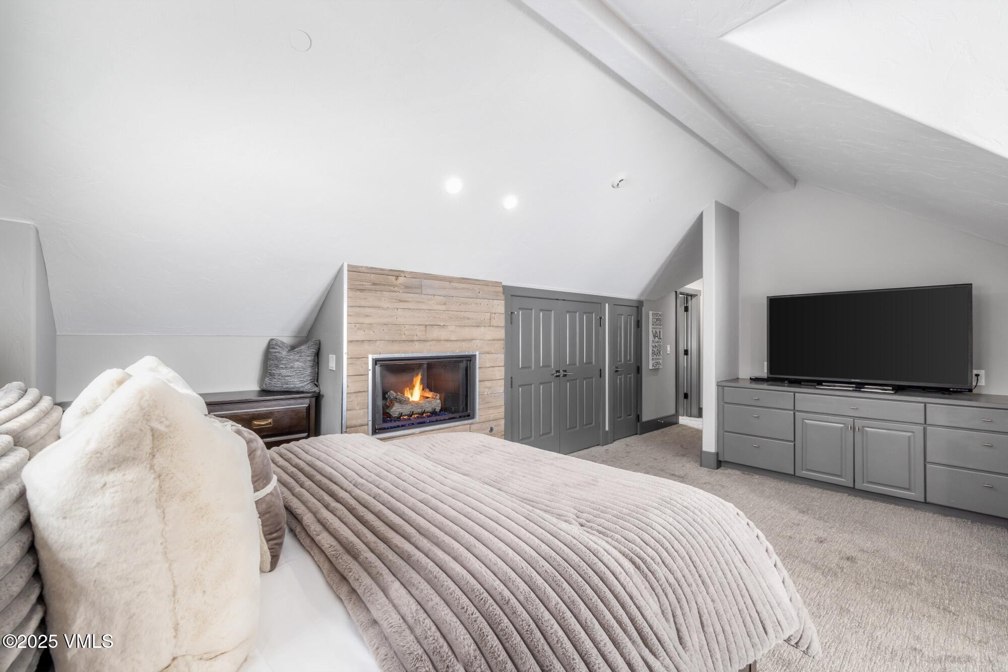 25 West Timber Drive Edwards, CO 81632 - Photo 39 of 55 a bedroom with a bed and a flat screen tv