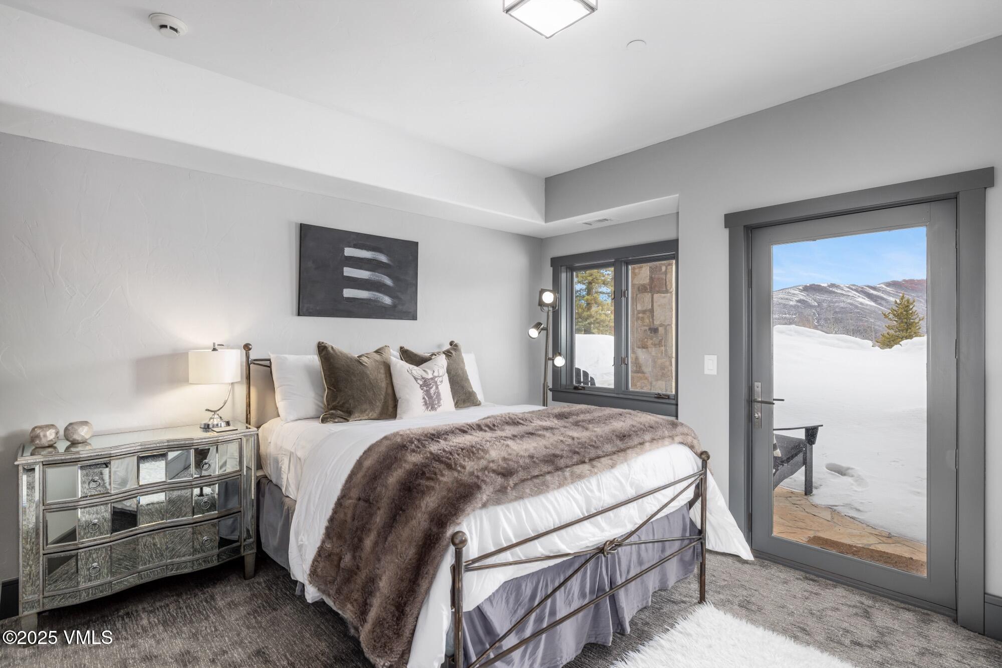 25 West Timber Drive Edwards, CO 81632 - Photo 43 of 55 a bedroom with a bed and a mirror