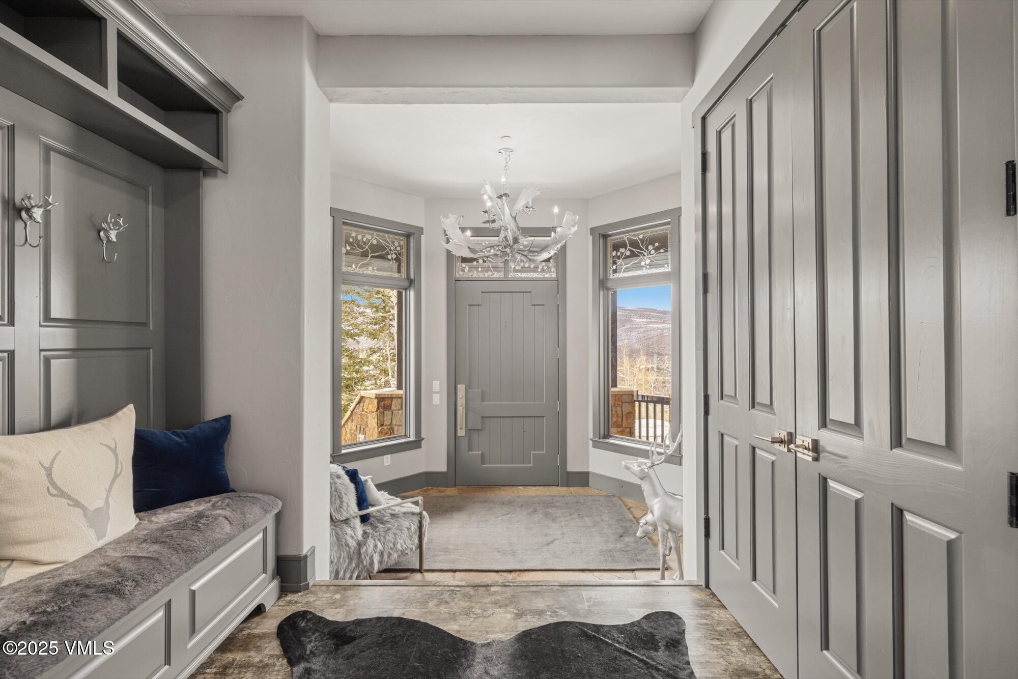 25 West Timber Drive Edwards, CO 81632 - Photo 50 of 55 a living room with furniture and a chandelier
