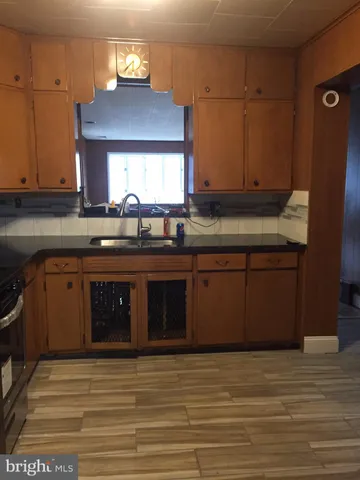 a kitchen with a sink and cabinets