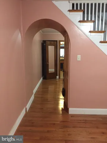 a view of gallery with wooden floor