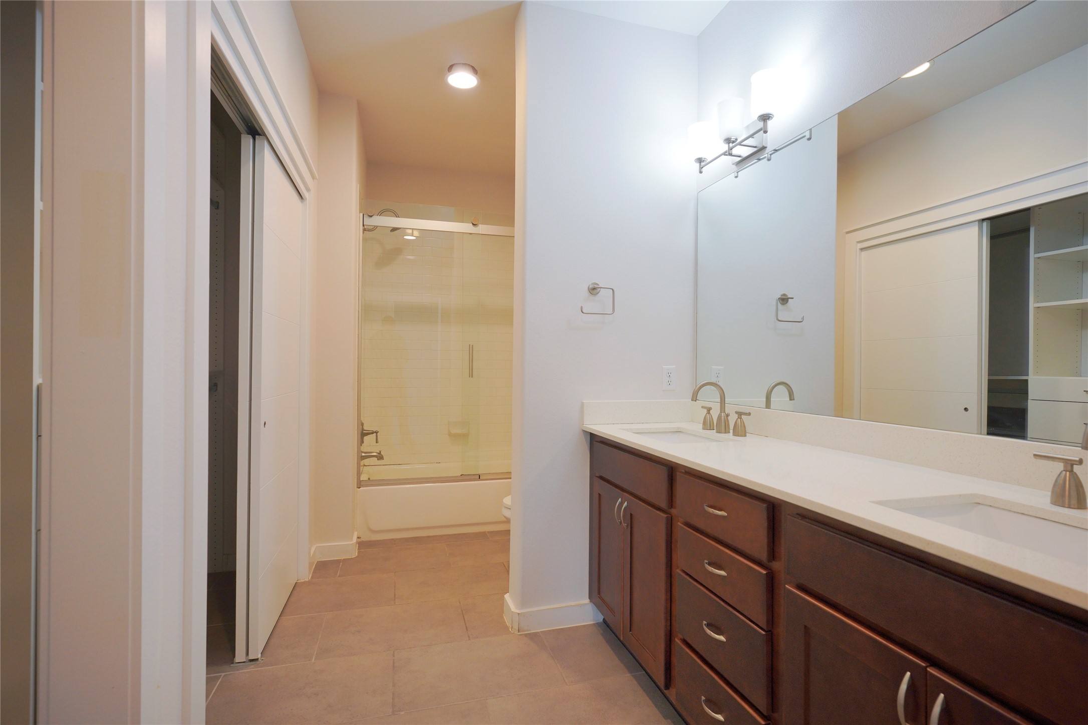 8945 Parker Ranch Circle, Unit A Austin, TX 78748 - Photo 12 of 25 a bathroom with a sink and a mirror