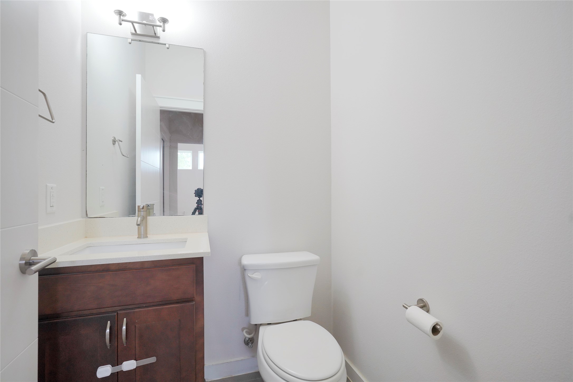 8945 Parker Ranch Circle, Unit A Austin, TX 78748 - Photo 15 of 25 a bathroom with a toilet a sink and mirror