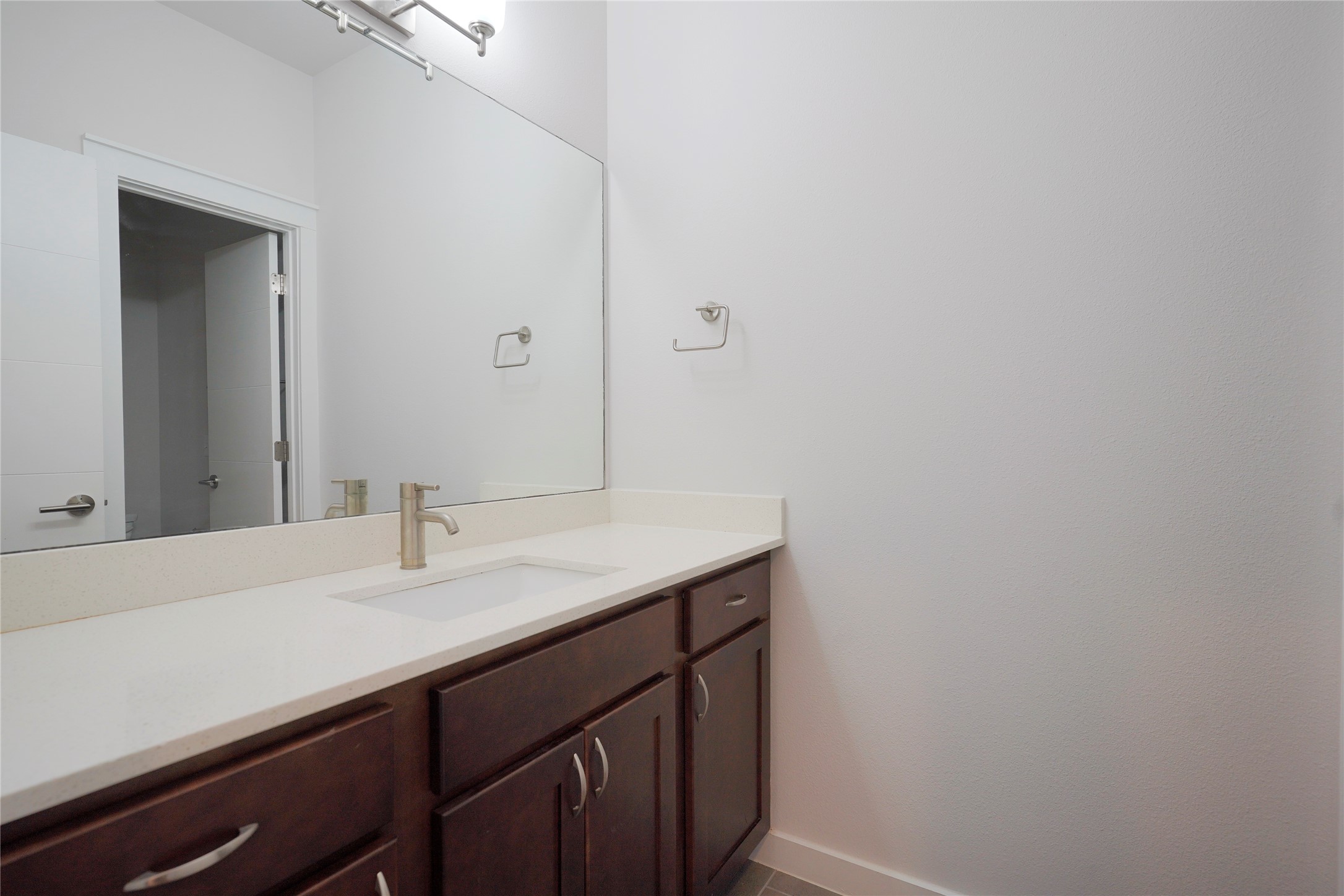 8945 Parker Ranch Circle, Unit A Austin, TX 78748 - Photo 21 of 25 a bathroom with a sink and a mirror