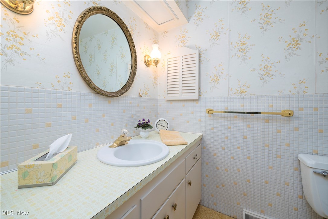 26907 Lake Road Bay Village, OH 44140 - Photo 15 of 33 The main bath is located on the second floor and is a nice size. This bath features a large vanity that is great for storage.