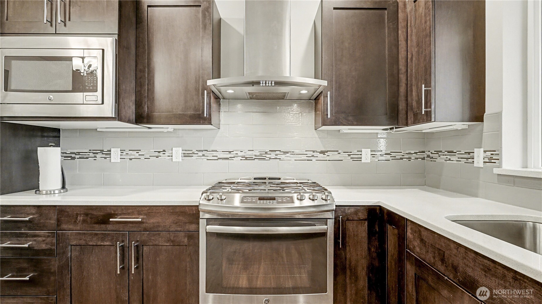 20403 93rd Place South, Unit 902 Kent, WA 98031 - Photo 11 of 40 a view of a kitchen with sink stove and microwave