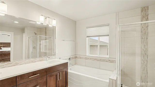a bathroom with a bathtub and a sink