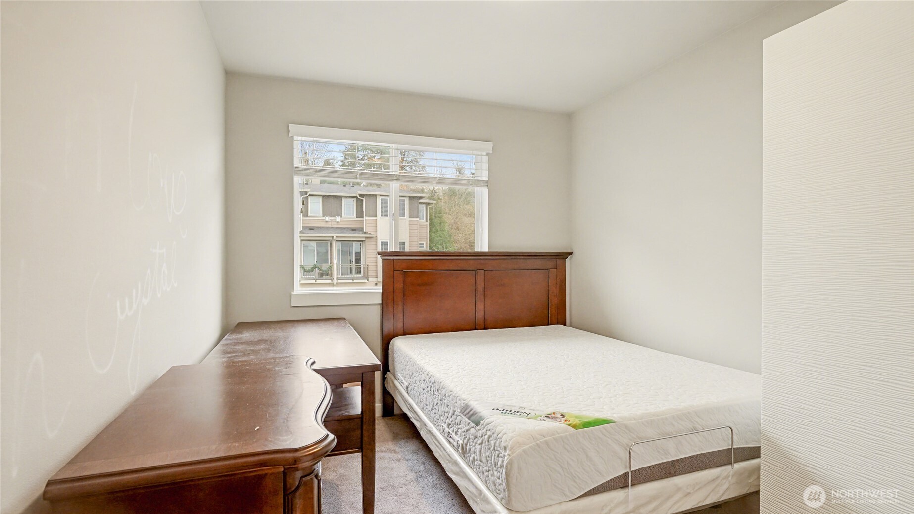 20403 93rd Place South, Unit 902 Kent, WA 98031 - Photo 29 of 40 a bedroom with a bed and a window