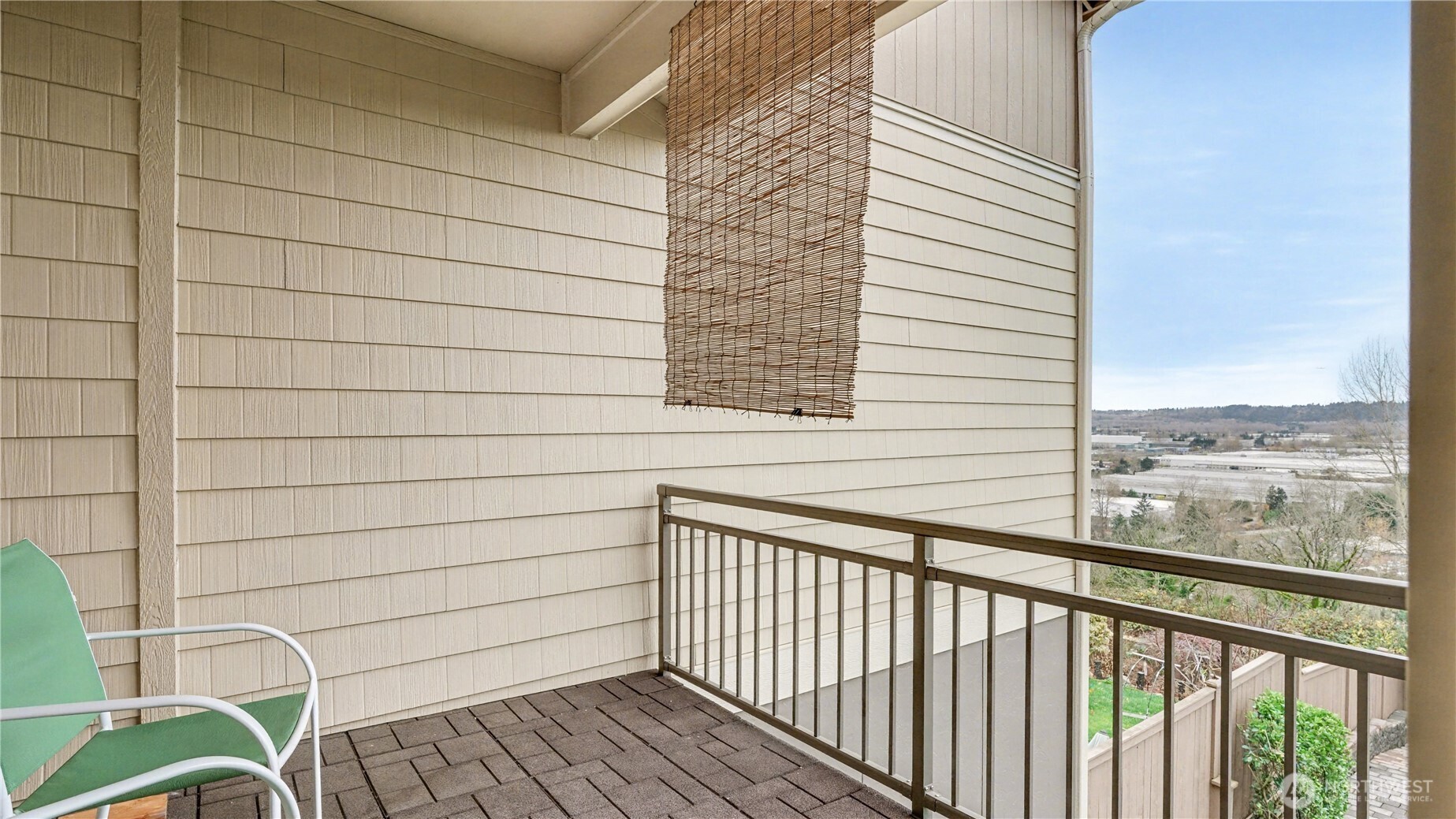 20403 93rd Place South, Unit 902 Kent, WA 98031 - Photo 33 of 40 a view of a balcony with chair and table