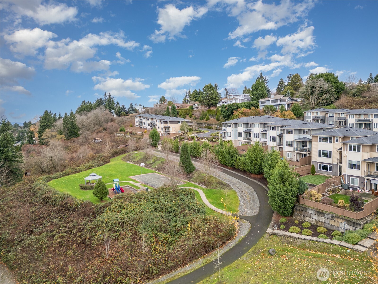20403 93rd Place South, Unit 902 Kent, WA 98031 - Photo 38 of 40 a view of a lake with a garden
