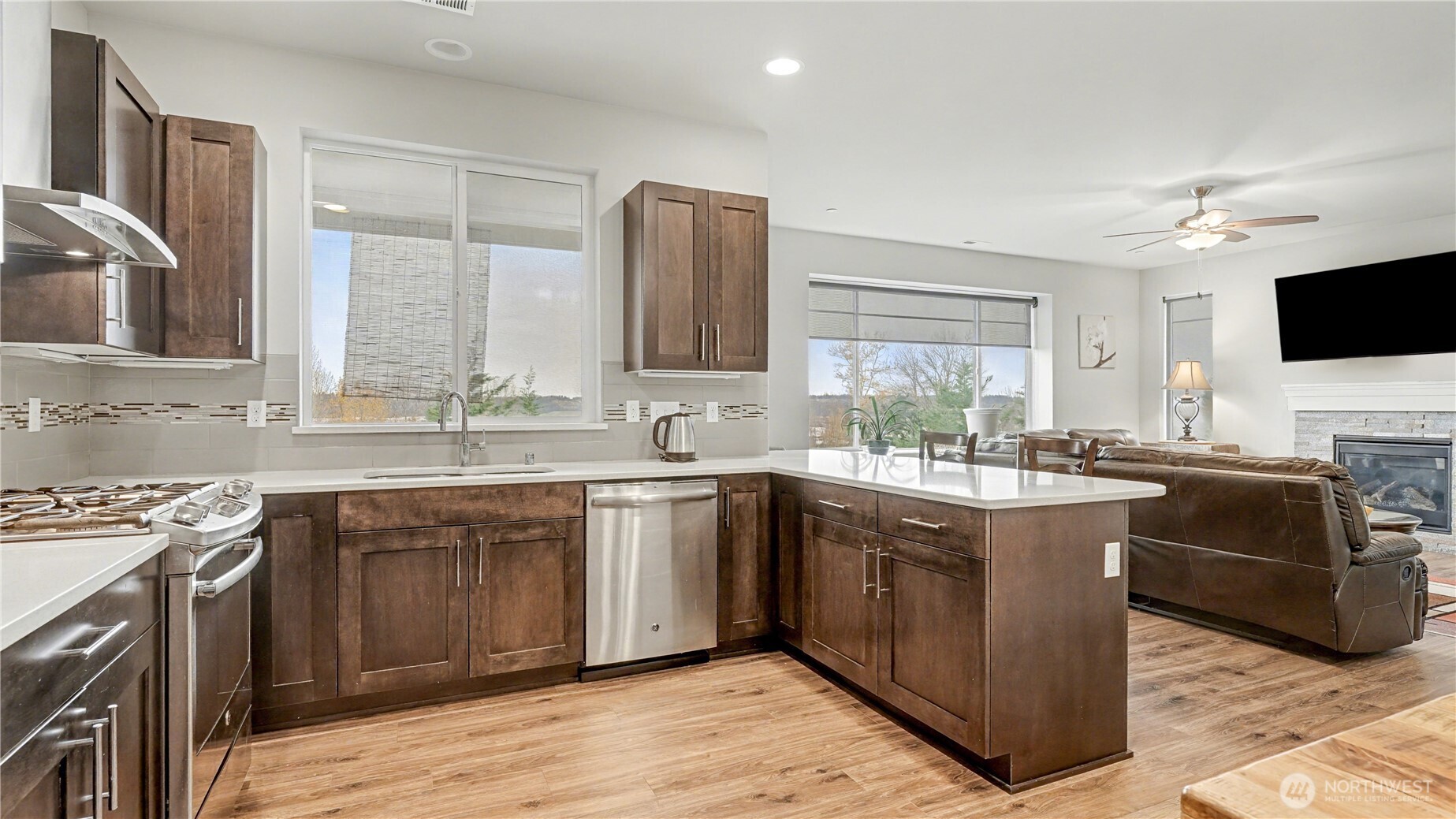 20403 93rd Place South, Unit 902 Kent, WA 98031 - Photo 10 of 40 a kitchen with stainless steel appliances granite countertop a sink stove and oven