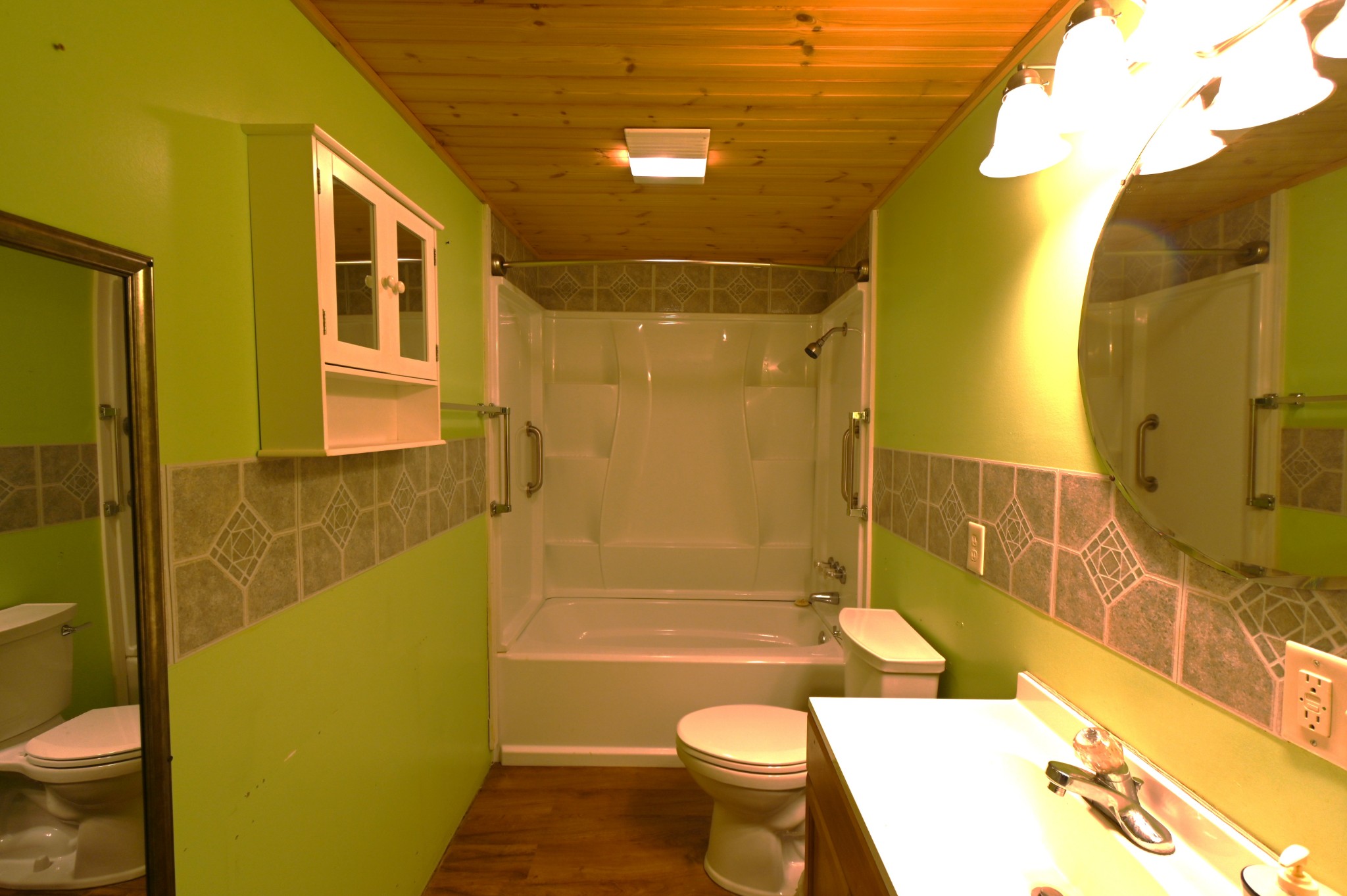 2383 Airport Ridge Road Linden, TN 37096 - Photo 56 of 64 a bathroom with a granite countertop bathtub sink mirror vanity and toilet