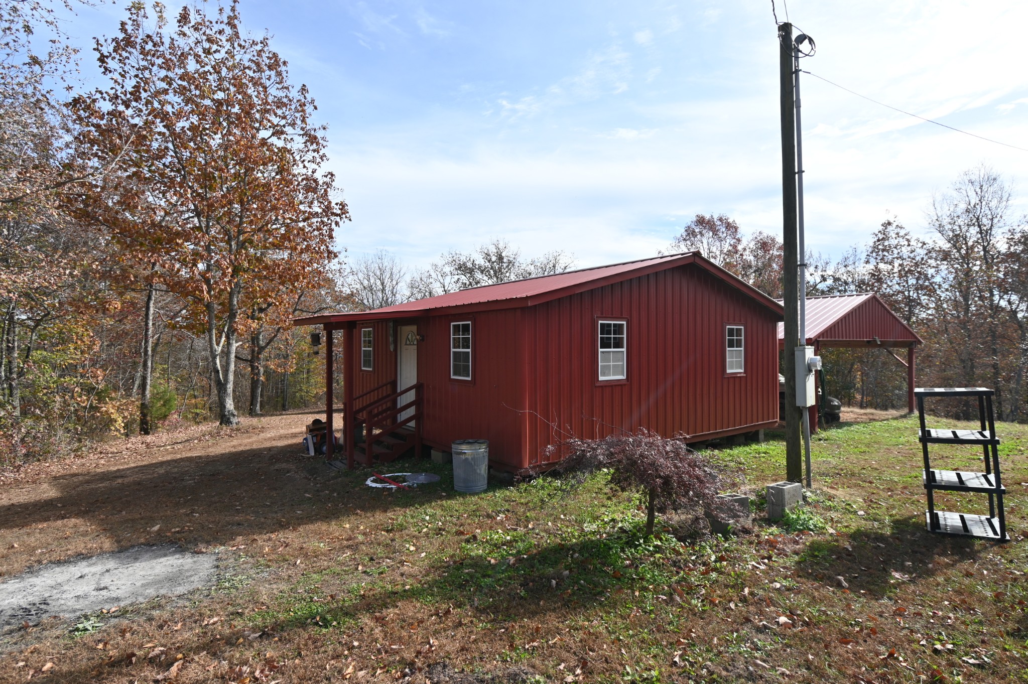 2383 Airport Ridge Road Linden, TN 37096 - Photo 10 of 64 a backyard of a house with lots of green space