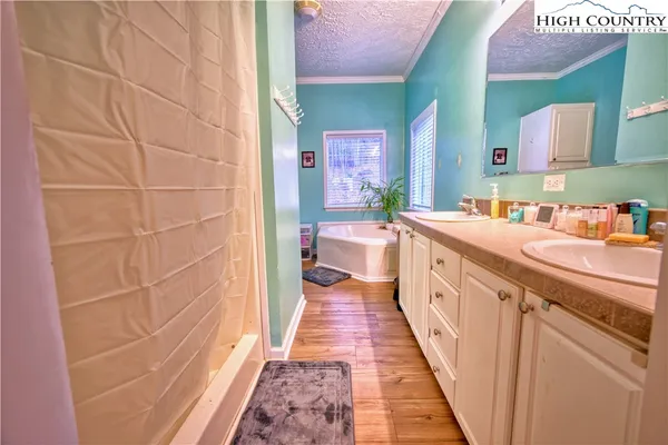a bathroom with a sink a mirror and a bathtub