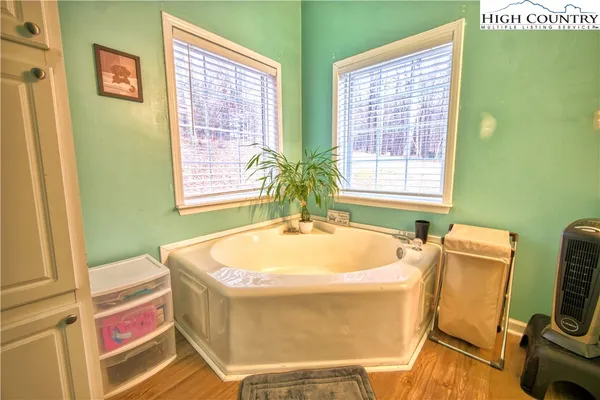 a bath tub sitting next to a blue sink