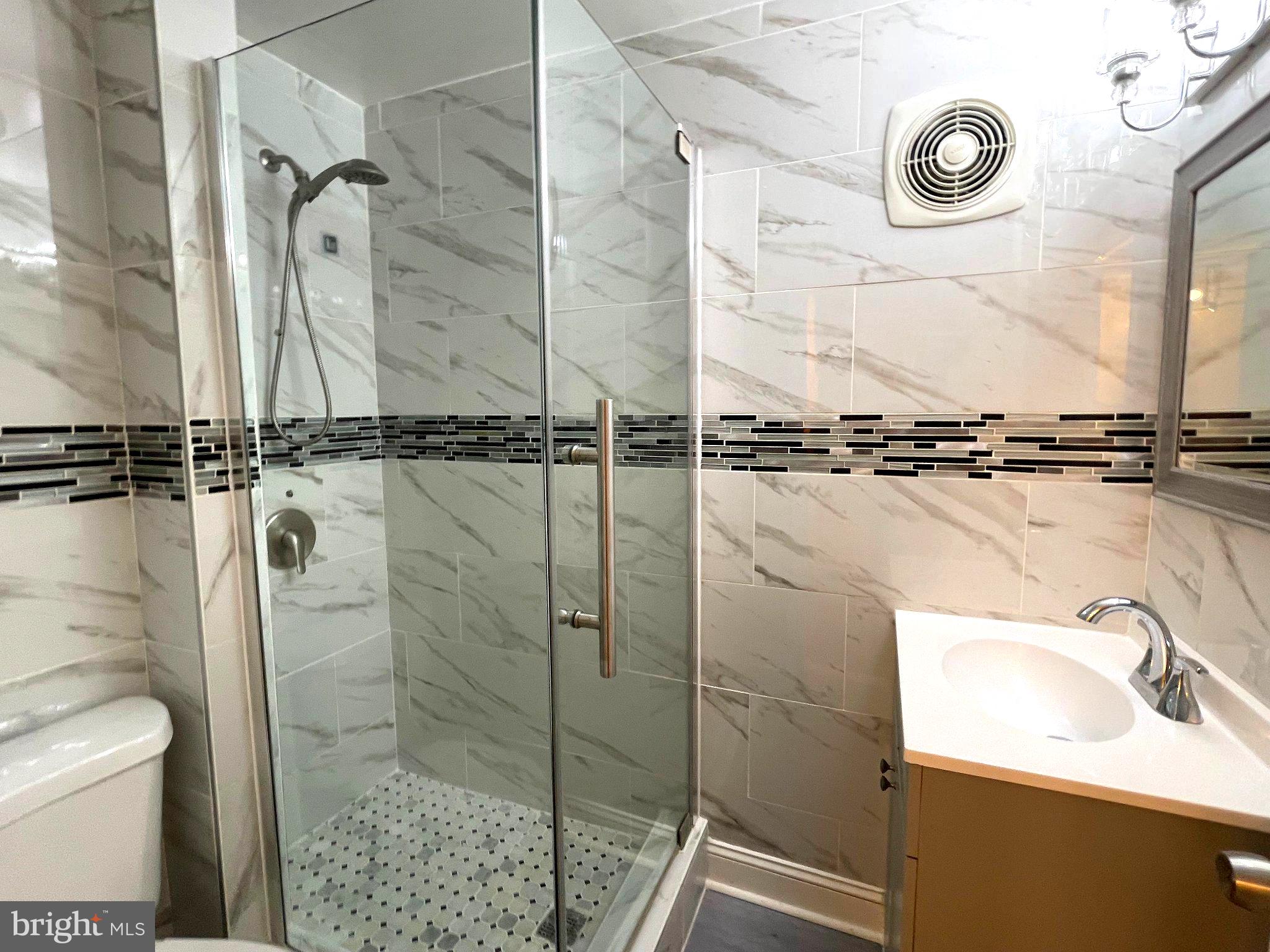 1530 Minnesota Road Camden, NJ 08104 - Photo 14 of 22 a bathroom with a sink a toilet and shower