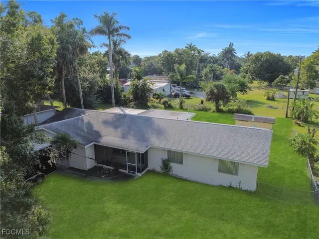 an aerial view of a house having yard