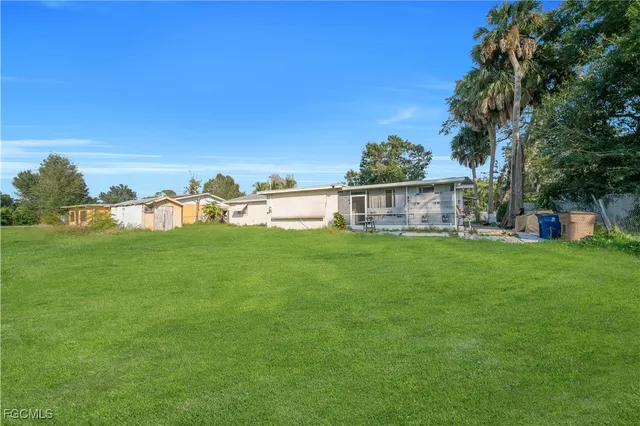 a house view with swimming pool in front of it