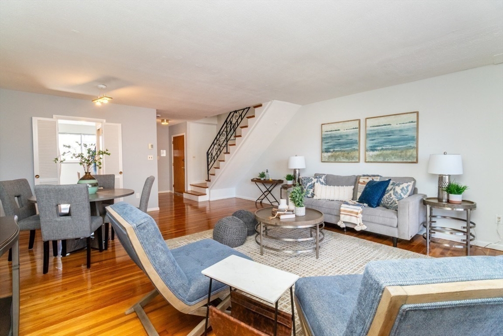 57 St Paul Street, Unit 19 Brookline, MA 02446 - Photo 4 of 23 a living room with furniture and a large window