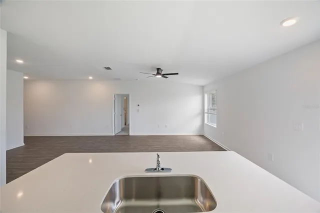 a bathroom with a sink and vanity