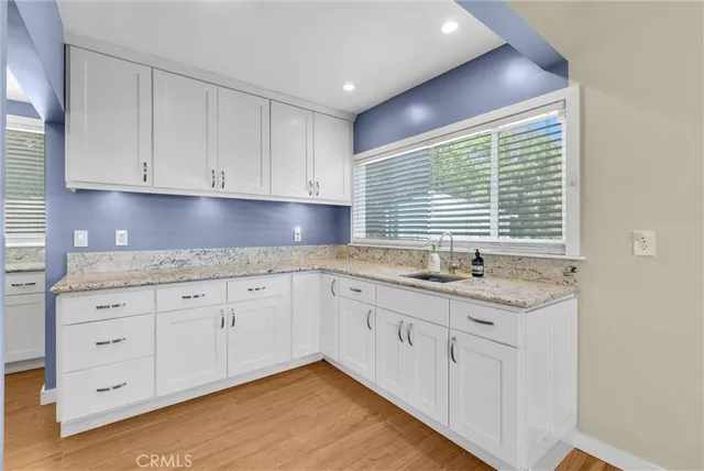 a kitchen with stainless steel appliances granite countertop a stove a refrigerator and a refrigerator