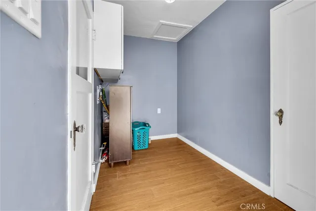 an aerial view of a house with a yard and trees