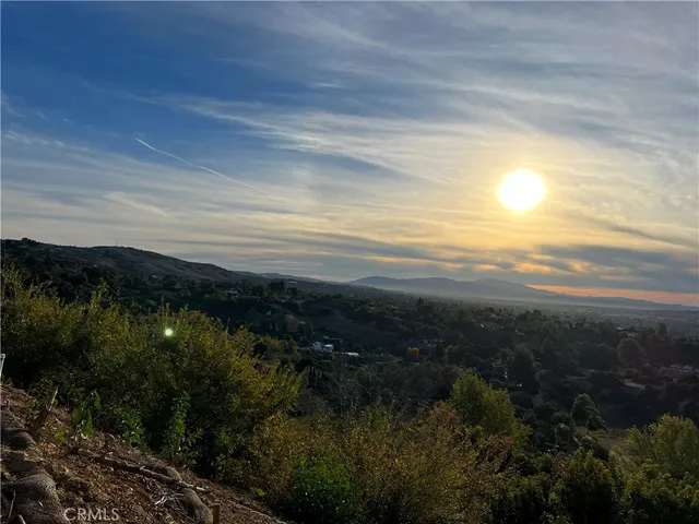 a view of an ocean and mountain