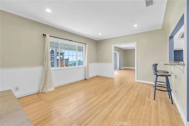 a view of kitchen with furniture and wooden floor
