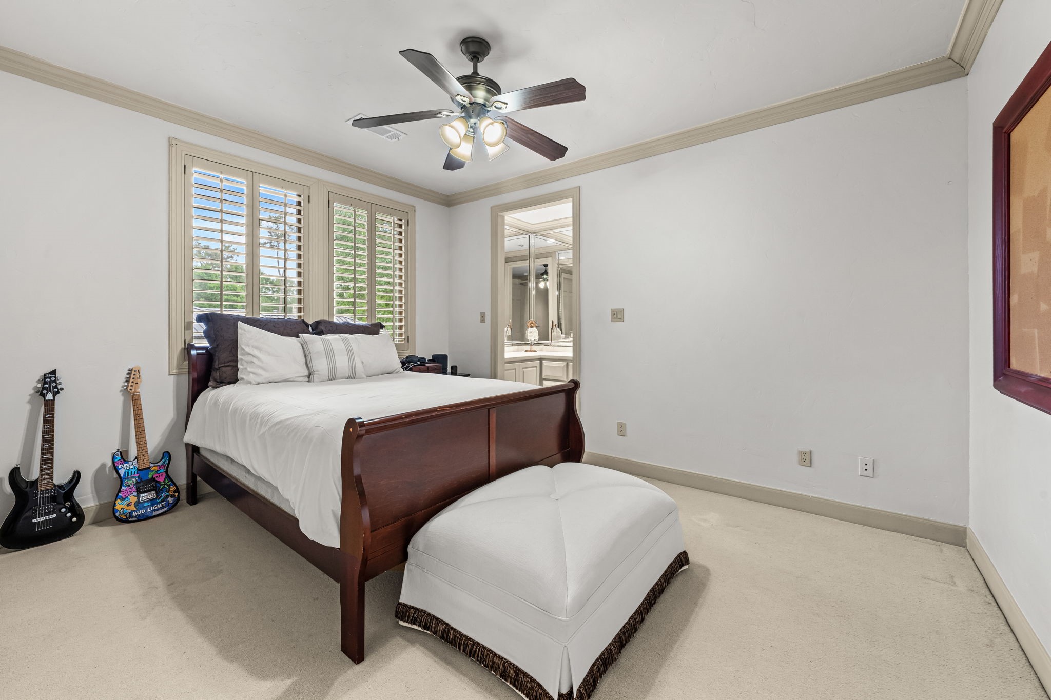 6 Mott Lane Houston, TX 77024 - Photo 42 of 50 Secondary bedroom with plus carpet and plantation shutters.