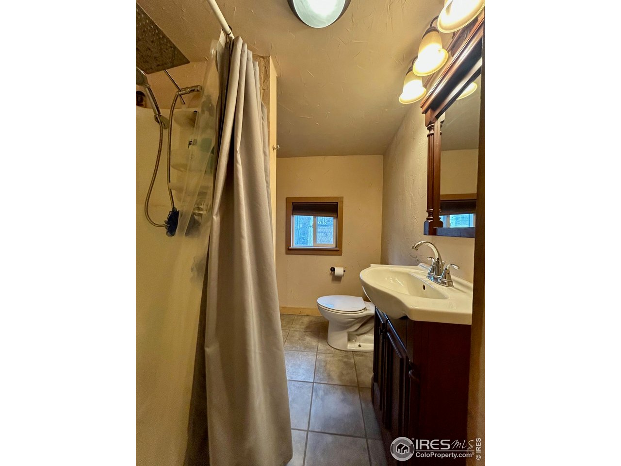 27 Gap Road Black Hawk, CO 80422 - Photo 12 of 36 a bathroom with a sink and a mirror