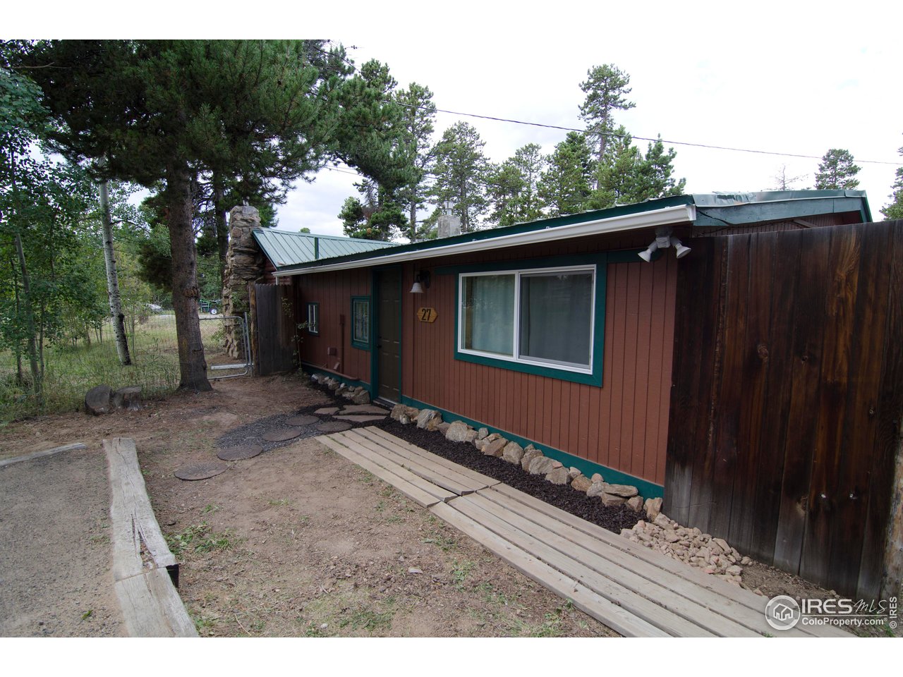 27 Gap Road Black Hawk, CO 80422 - Photo 28 of 36 a backyard of a house with lots of green space
