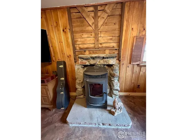 a view of living room with furniture and a fireplace
