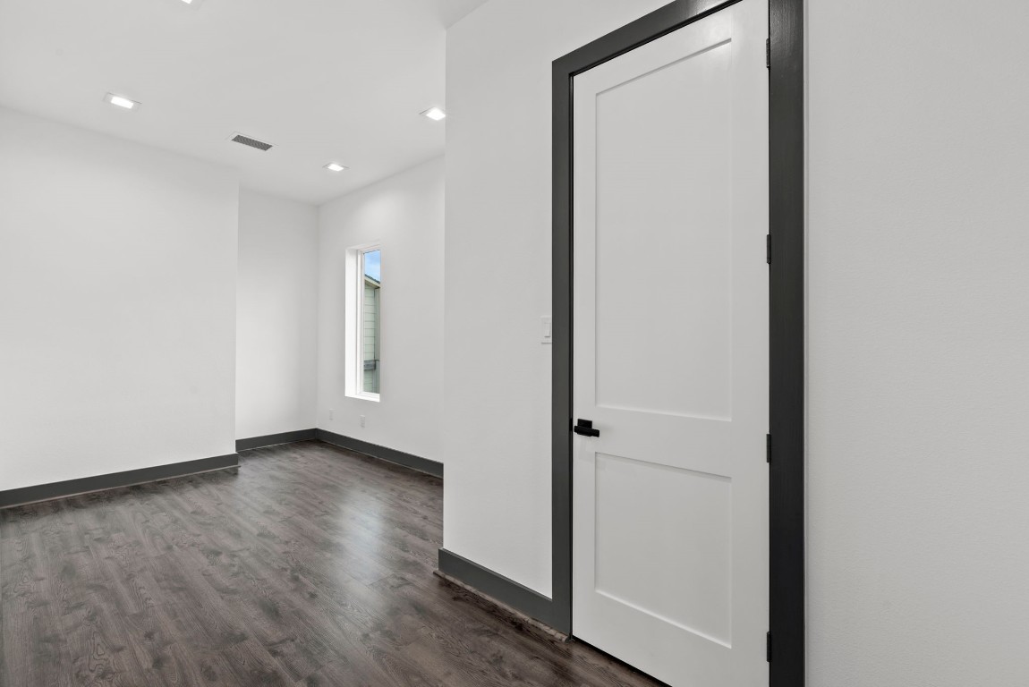 3118 Clay Street Houston, TX 77003 - Photo 13 of 32 a view of a hallway with wooden floor
