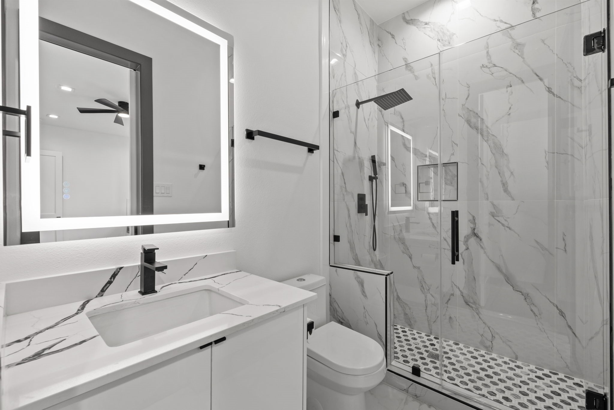 3118 Clay Street Houston, TX 77003 - Photo 8 of 32 a bathroom with a sink toilet a mirror and shower