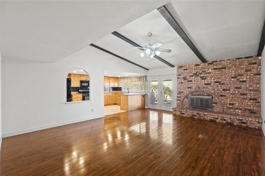 5619 Pine Row Street Houston, TX 77049 - Photo 2 of 8 a view of a hall with wooden floor